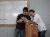 Photo taken in 2009 by Luis F Molina -His 2 youngest sons joking at their father's hand gestures